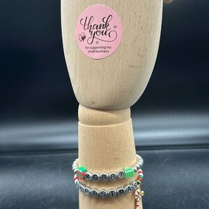 Silver Merry Christmas bracelet w/silver letters, beads and assorted charms